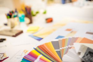 Color swatch on designers desk, blurred background.